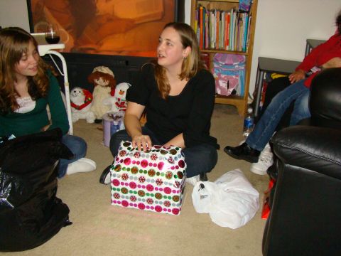 1989 Ford Bronco - A group of people are gathered indoors, sitting on the floor with presents, suggesting a holiday celebration.