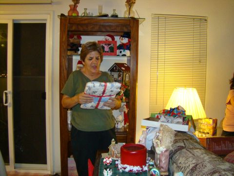 1989 Ford Bronco - A woman is holding a gift, possibly during a holiday celebration.