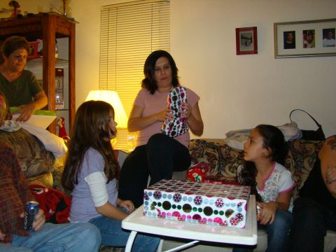 1989 Ford Bronco - A family celebrates a gift exchange in a living room.