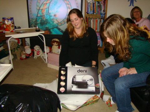 1989 Ford Bronco - A holiday gathering with people opening presents, including a new deli slicer.