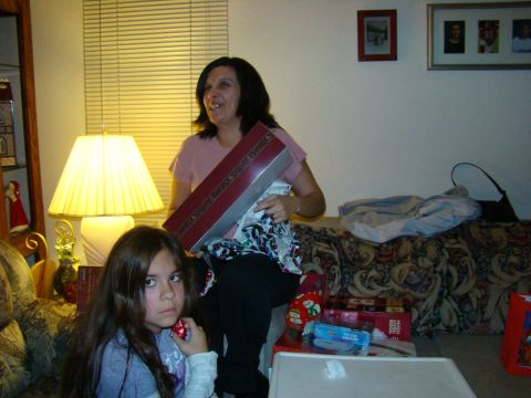 1989 Ford Bronco - Two people are opening gifts in a living room setting.