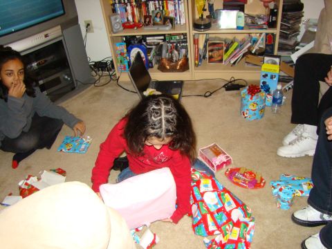 1989 Ford Bronco - Children and adults are gathered on the floor, opening presents on Christmas morning.