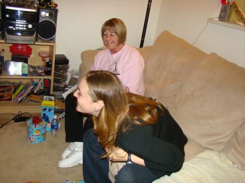 1989 Ford Bronco - Two women are in a living room, one sitting on a couch and the other in front of her.