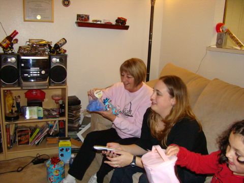 1989 Ford Bronco - A family gathers to open presents, with gifts and decorations visible in the room.