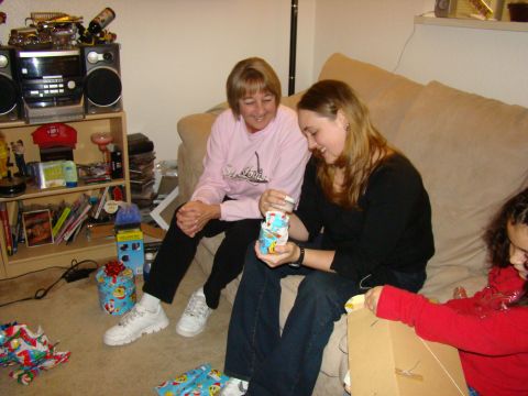 1989 Ford Bronco - A family enjoys opening Christmas gifts together on the couch.