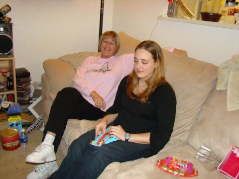 1989 Ford Bronco - Two women relax on a couch, with snacks and drinks nearby.