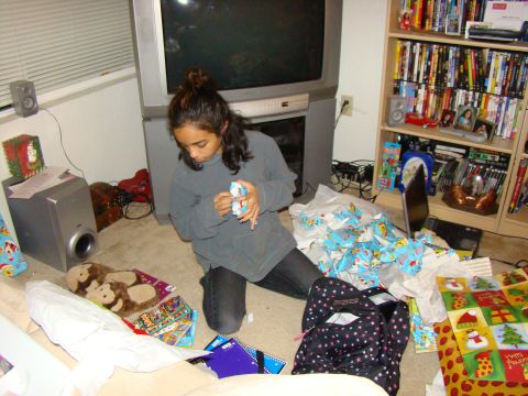 1989 Ford Bronco - A young girl sits on the floor surrounded by wrapping paper and gifts.