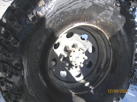 1994 Ford Bronco - A close-up view of a "Super Swamper" tire and wheel assembly, dated 12/09/2007.