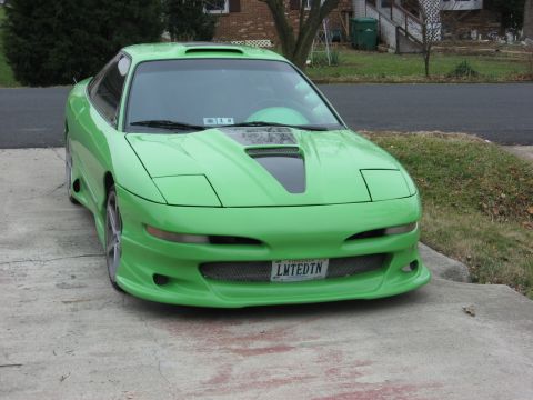 1994 Ford Probe - Front view of a modified 1994 Ford Probe with a custom body kit and hood scoop.