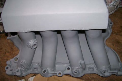 1988 Ford Bronco - Intake manifold with four runners, likely for a V8 engine.