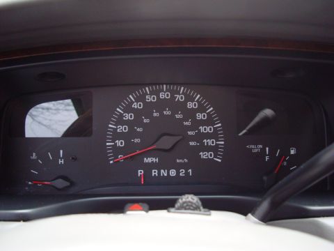2002 Lincoln Town Car - The instrument cluster shows the speedometer, fuel level, and gear selection indicator.