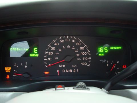 2002 Lincoln Town Car - The dashboard displays mileage, fuel status, and distance to empty, consistent with a 2002 Lincoln Town Car.