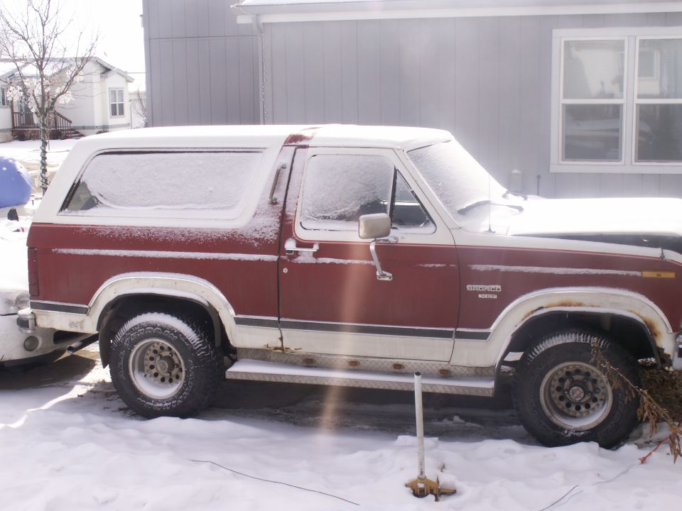 1984 Ford Bronco parked in snow, side view