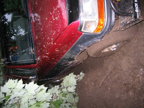 1995 Ford Bronco - This 1995 Ford Bronco is stuck in the mud, with its front fender and wheel submerged.