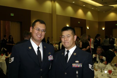 1994 Ford Bronco - Two men in formal military dress uniforms pose for a photo at what appears to be a formal gathering or banquet.