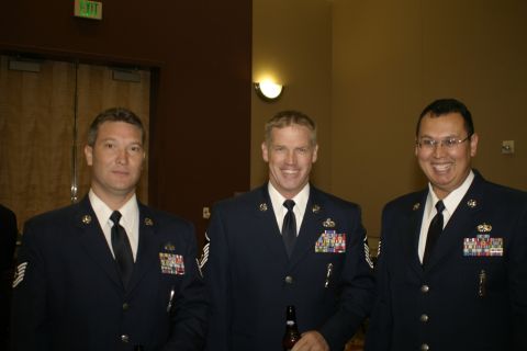 1994 Ford Bronco - Three men in uniform pose for a photo indoors.
