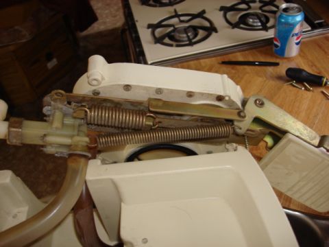 1983 Ford Bronco - After removing the screws the lower half comes right up. i had to disconnect 2 hoses and the base is set aside.