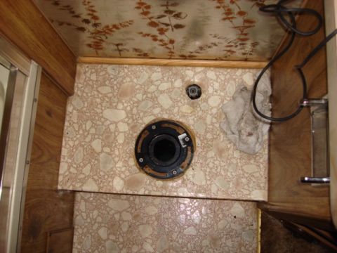 1983 Ford Bronco - here is the new flange installed. it was called an inside slider flange and purchased from Home Depot for $4. i glued and then screwed the…
