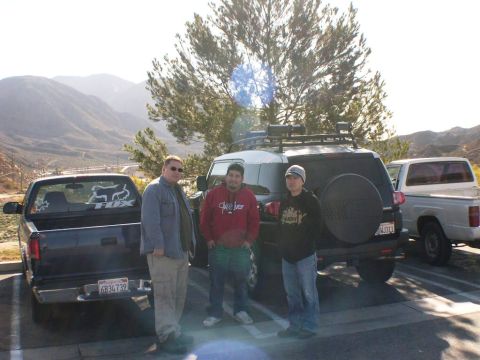 2007 Toyota FJ Cruiser - Three men pose with their vehicles, including a Toyota FJ Cruiser, in a scenic outdoor setting.