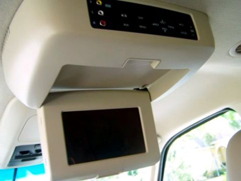 2003 Ford Expedition - Interior view of an overhead entertainment system with a screen and buttons.