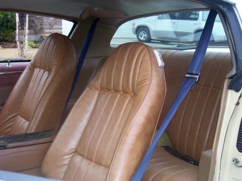 1979 Chevrolet Camaro - Tan interior with blue seatbelts visible in a 1979 Chevrolet Camaro.