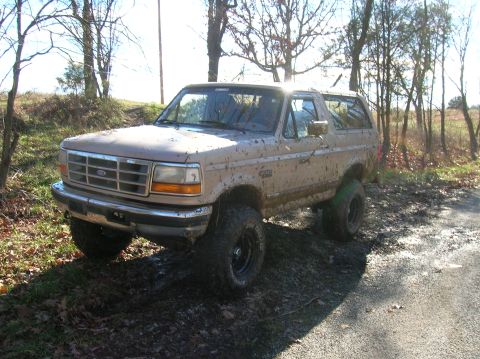 1996 Ford Bronco - This 1996 Ford Bronco is covered in mud after driving off-road.