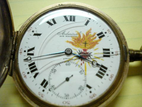 1994 Ford Bronco - This pocket watch features a detailed illustration of the Sacred Heart, surrounded by flames and a cross.