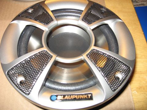 1992 Ford Crown Victoria - Close-up of a Blaupunkt car speaker, showing its intricate design and branding.