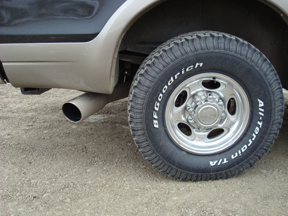 Close-up of the new 4" MagnaFlow exhaust with a dirty 5" chrome tip.