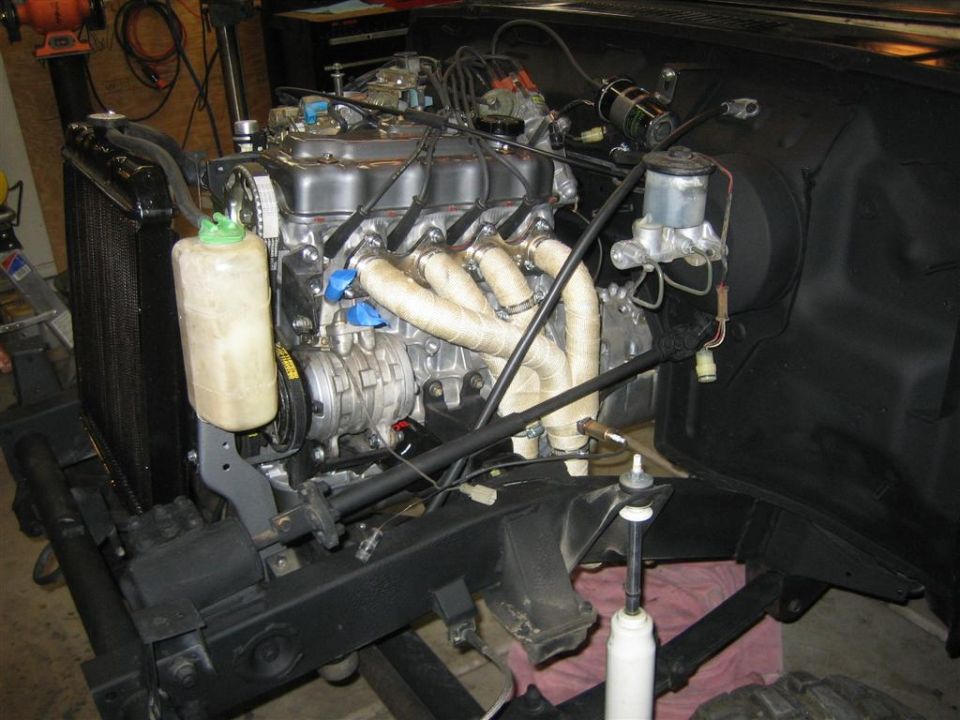 engine and radiator in a vehicle, appears to be under construction