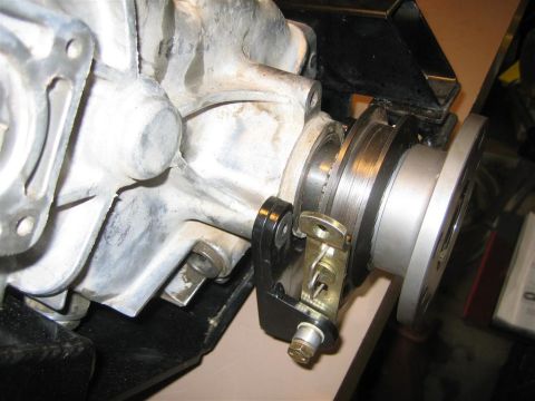 1987 Suzuki Samurai - Close-up of a vehicle's transfer case assembly, showing mechanical components and linkage.