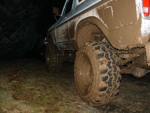 1978 Ford Bronco - This 1978 Ford Bronco is heavily covered in mud, suggesting it has been used for off-roading.