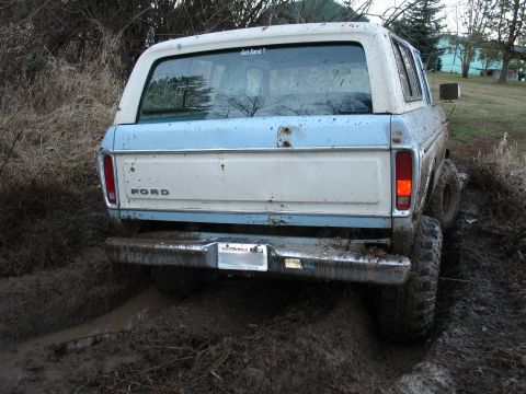 1978 Ford Bronco - This 1978 Ford Bronco is deep in the mud, with a humorous 'Got Sand?' sticker on its rear window.