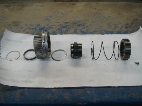 1996 Ford Bronco - Disassembled Warn Manual Hub parts laid out on a white paper towel.