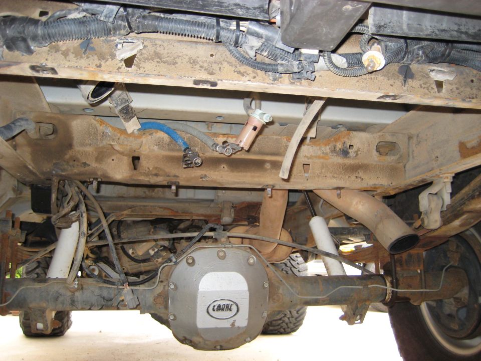 Undercarriage of 1996 Ford Bronco showing rear axle and exhaust