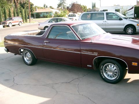 1968 Ford Mustang — Maroon 1970 Ford Ranchero 500 pickup truck parked on driveway, other vehicles in background