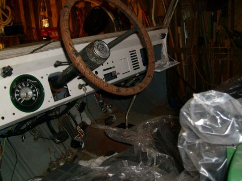 1974 Ford Bronco - The interior of a 1974 Ford Bronco shows the dashboard, steering wheel, and exposed wiring.