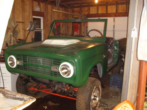 1974 Ford Bronco - This 1974 Ford Bronco is undergoing restoration in a garage, missing its doors and top.
