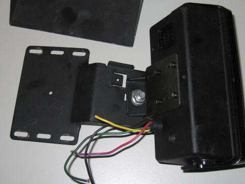 2001 Ford Crown Victoria - Close-up of an automotive part, likely an electrical component or sensor, with wiring.