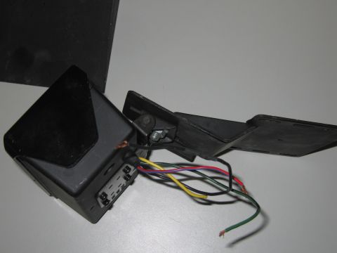 2001 Ford Crown Victoria - A disassembled automotive mirror light assembly with multiple colored wires is shown.
