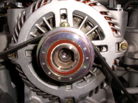 2005 Ford Crown Victoria - Alternator pulley detail, showing the bearing and drive belt.