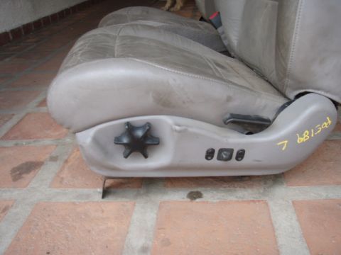 1995 Ford F-150 - Car seat with power controls and adjustment knob, likely from a truck or SUV.