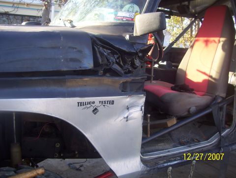 1978 Ford Bronco - Interior view shows a roll cage and damaged front fender with "Tellico Tested" decal. The registry claims this is a 1978 Ford Bronco, but t…