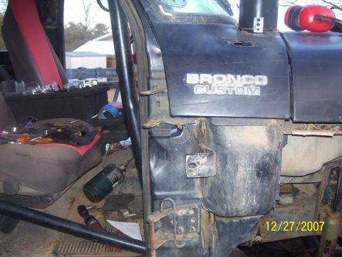 1978 Ford Bronco - Interior view of a vehicle, the dashboard and seats, with tools and a propane tank visible.