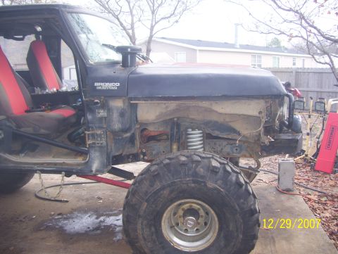 1978 Ford Bronco - This modified vehicle appears to be a Ford Bronco, but the front end is disassembled, making exact year identification difficult.