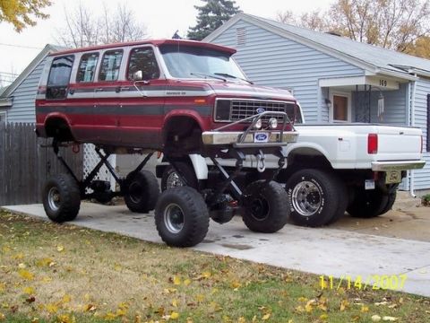 1979 Ford F-250 - This heavily modified van sits atop a custom chassis, dwarfing the pickup truck beside it.