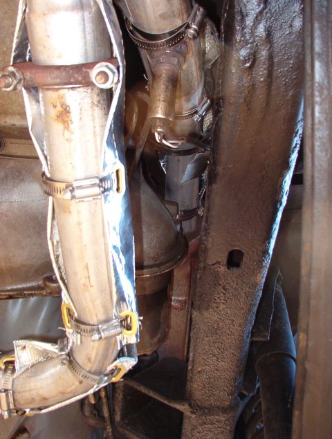 1975 Ford Bronco - To keep even more heat out, all the exhaust pipes near the body are now wrapped. This stuff smokes & stinks the first few times the engine…