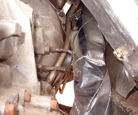 1975 Ford Bronco - To keep even more heat out, all the exhaust pipes near the body are now wrapped. This stuff smokes & stinks the first few times the engine…