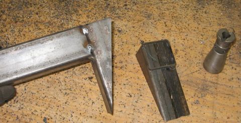 1990 Ford Bronco - Close-up of fabricated metal components and a specialized tool, likely for automotive repair or fabrication.
