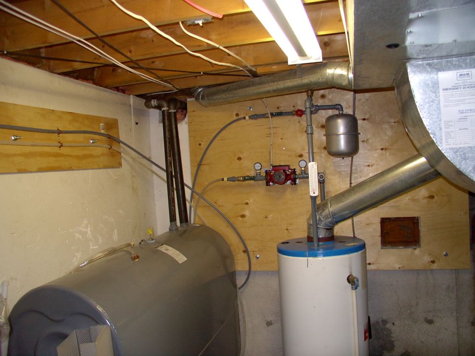 Separate oil water heater filled with glycol. Small cushion tank, very small 3 speed pump (less than 1 amp). Auto pressure release valve at the very top of the piping.